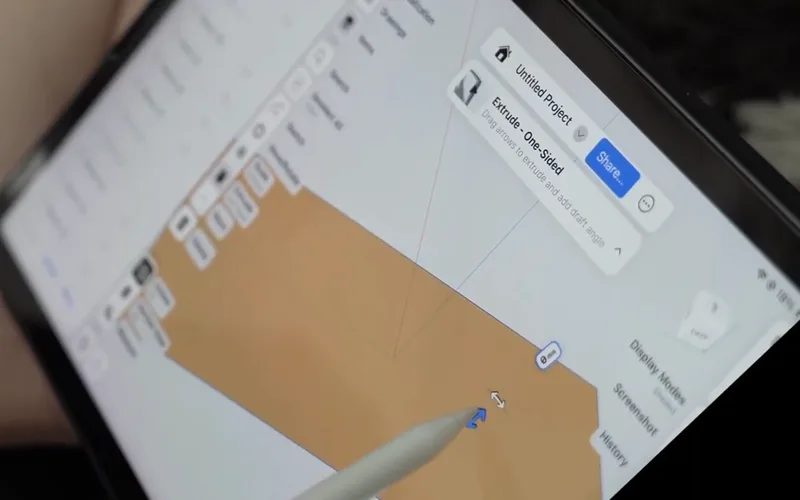 An iPad screen with an orange box being modelled in a CAD app