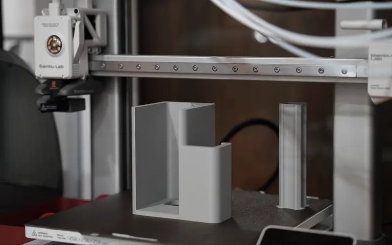 A Bambu Lab A1 printing the white box