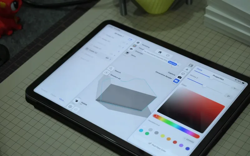 iPad với khối lập phương đỏ trắng và bảng màu