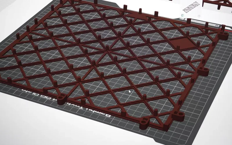 A brown CAD model of the tile with the pins removed from one face